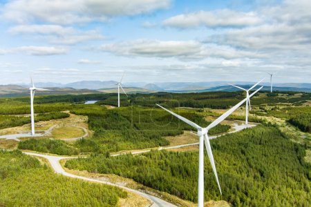 Photo for Connemara aerial landscape with wind turbines of Galway Wind Park located in Cloosh Valley, County Galway. Largest onshore wind farm in Ireland, green energy generation. Galway Wind Way recreation. - Royalty Free Image