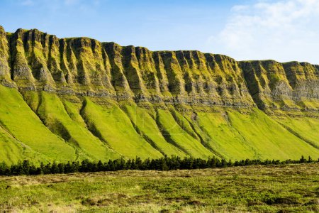 Photo for Aerial view of Benbulbin, aka Benbulben or Ben Bulben, iconic landmark, large flat-topped nunatak rock formation. Magnificent costal driving route view at Wild Atlantic Way, County Sligo, Ireland. - Royalty Free Image