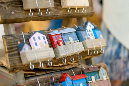 Photo for Wooden decorative key holder houses sold on annual Nations Fair, where masters from the national communities of Lithuania present their arts, crafts and traditions. Vilnius, Lithuania. - Royalty Free Image