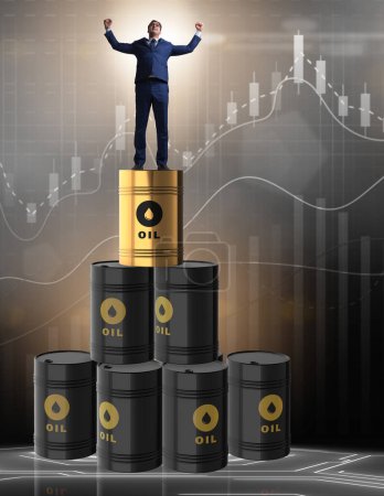 Photo for The businessman on top of oil barrels - Royalty Free Image