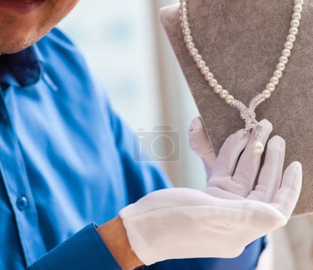 Photo for The young jeweler working in his workshop - Royalty Free Image