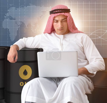 Photo for The arab businessman trading crude oil on laptop - Royalty Free Image