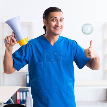 Photo for The young male doctor working in the clinic - Royalty Free Image