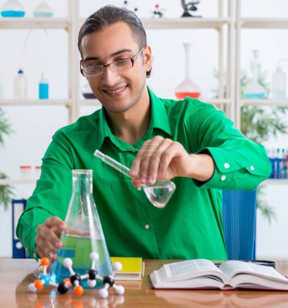 Photo for The chemistry student studying for exams - Royalty Free Image