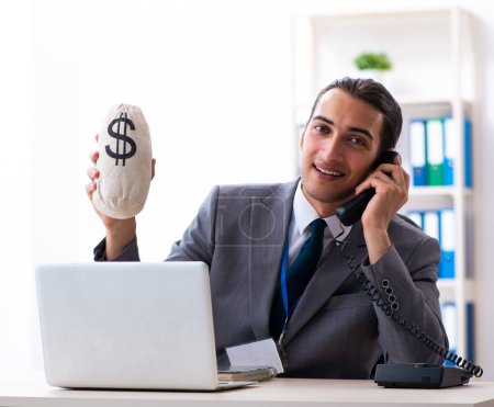 Photo for The young male accountant working in the office - Royalty Free Image