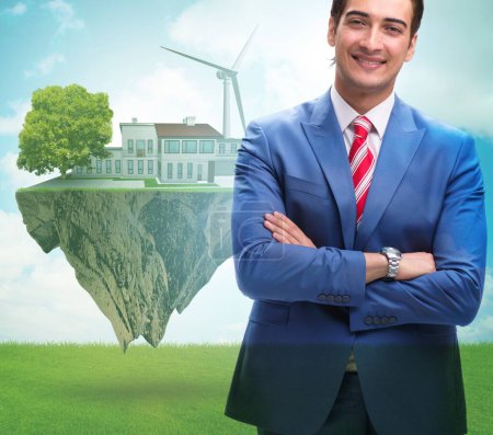 Foto de El concepto de ecología ecológica de la energía verde con el empresario - Imagen libre de derechos
