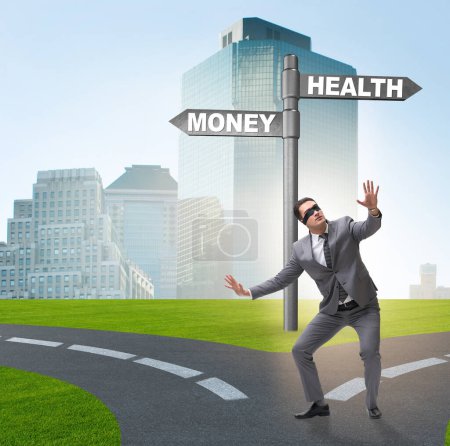 Photo for The businessman choosing between money and health - Royalty Free Image