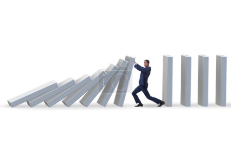 The businessman preventing domino effect in business concept
