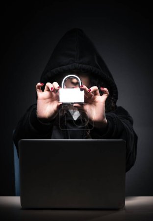 Photo for The female hacker hacking security firewall late in office - Royalty Free Image