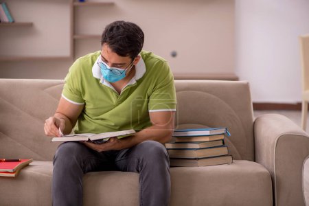 Photo for Young student preparing for exams at home during pandemic - Royalty Free Image
