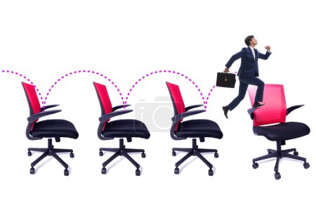 Téléchargez les photos : Concept de promotion avec les chaises de bureau et l'homme d'affaires - en image libre de droit