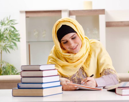 Photo for The female student in hijab preparing for exams - Royalty Free Image