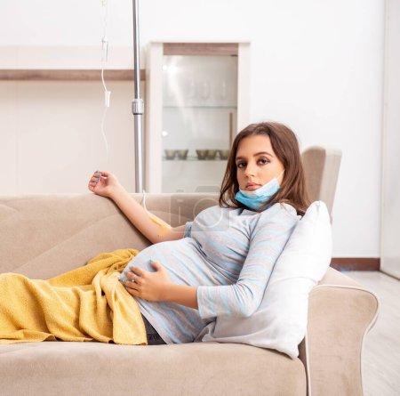 The sick pregnant woman suffering at home