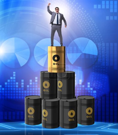 Photo for The businessman on top of oil barrels - Royalty Free Image