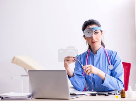 Photo for The young female doctor working in the clinic - Royalty Free Image