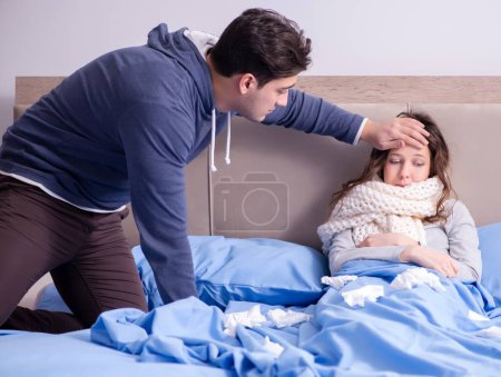 Photo for The wife caring for sick husband at home in bed - Royalty Free Image