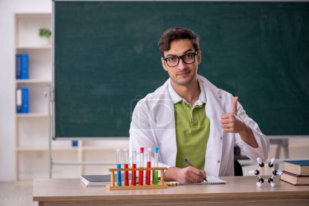 Photo for Young chemist in the classroom - Royalty Free Image