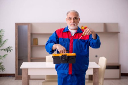 Photo for Old carpenter working at home - Royalty Free Image