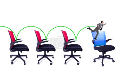 Téléchargez les photos : Concept de promotion avec les chaises de bureau et l'homme d'affaires - en image libre de droit