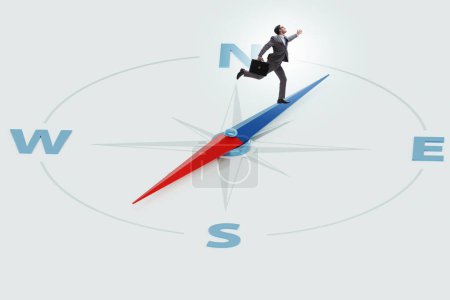 Photo for Businessman with the compass looking for direction - Royalty Free Image