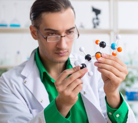 Photo for The young male chemist teacher in the lab - Royalty Free Image