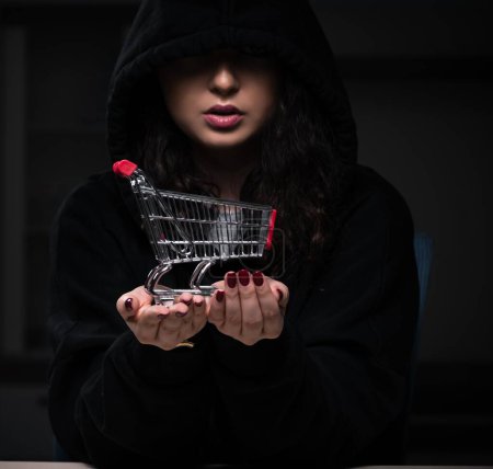 Photo for The female hacker hacking security firewall late in office - Royalty Free Image