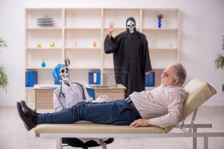 Photo for Old patient visiting two devil doctors - Royalty Free Image