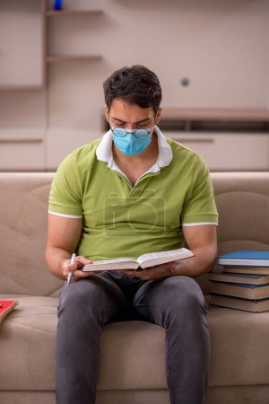 Photo for Young student preparing for exams at home during pandemic - Royalty Free Image