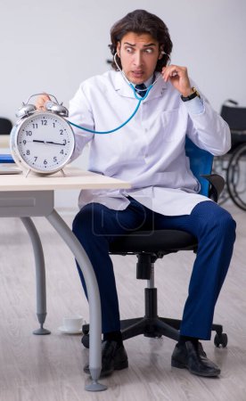 Photo for The young male doctor in time management concept - Royalty Free Image