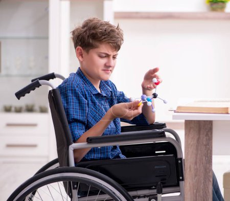 Photo for The disabled kid preparing for school at home - Royalty Free Image
