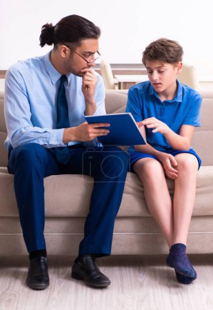 Photo for The internet addicted boy visiting male doctor - Royalty Free Image