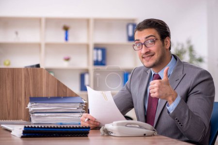 Photo for Young businessman employee at workplace - Royalty Free Image