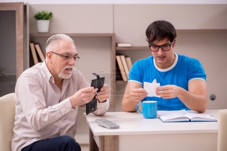 Photo for Young student and his grandfather at home - Royalty Free Image