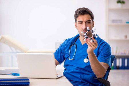 Photo for Young student doctor holding molecular model - Royalty Free Image