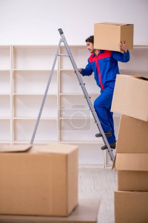 Photo for Young contractor doing home relocation - Royalty Free Image