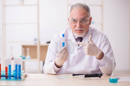 Photo for Old chemist working in the lab - Royalty Free Image