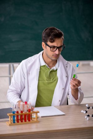 Photo for Young chemist in the classroom - Royalty Free Image