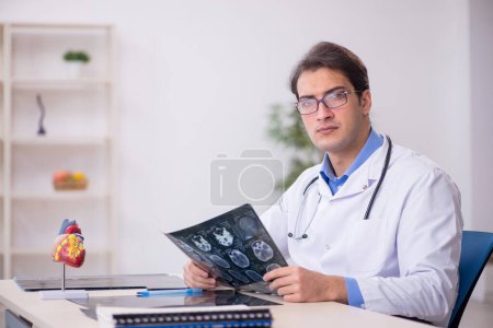 Photo for Young male doctor radiologist working in the clinic - Royalty Free Image