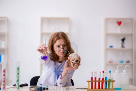 Photo for Young female chemist working at the laboratory - Royalty Free Image