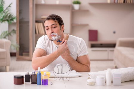 Photo for Young man shaving at home - Royalty Free Image