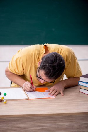 Photo for Young student sitting in the classroom - Royalty Free Image