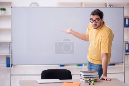 Photo for Young student sitting in the classroom - Royalty Free Image