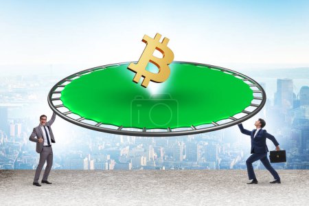 Photo for Monetary concept with cryptocurrency bouncing off trampoline - Royalty Free Image