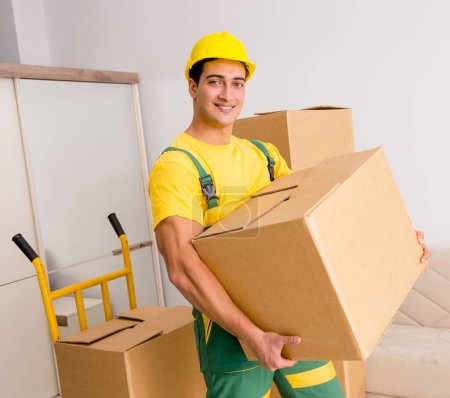 Photo for The man delivering boxes during house move - Royalty Free Image