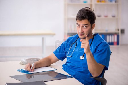 Photo for Young doctor working at the hospital - Royalty Free Image