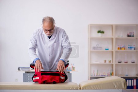 Photo for Aged male paramedic working at the hospital - Royalty Free Image