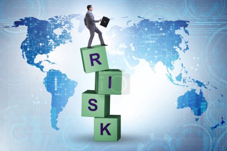 Foto de Risk management concept with businessman on the cubes - Imagen libre de derechos