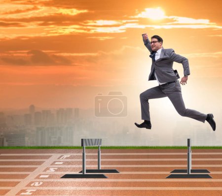 Photo for The businessman jumping over barriers in business concept - Royalty Free Image
