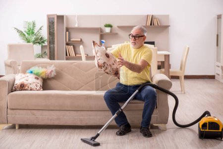 Photo for Old man cleaning the house - Royalty Free Image