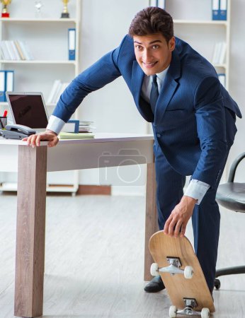 Photo for The young businessman with skate in office in sports concept - Royalty Free Image